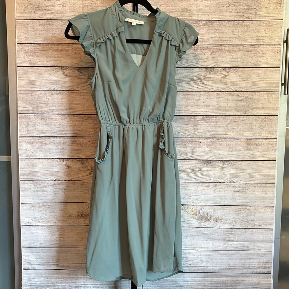 Small Sage dress with ruffle details